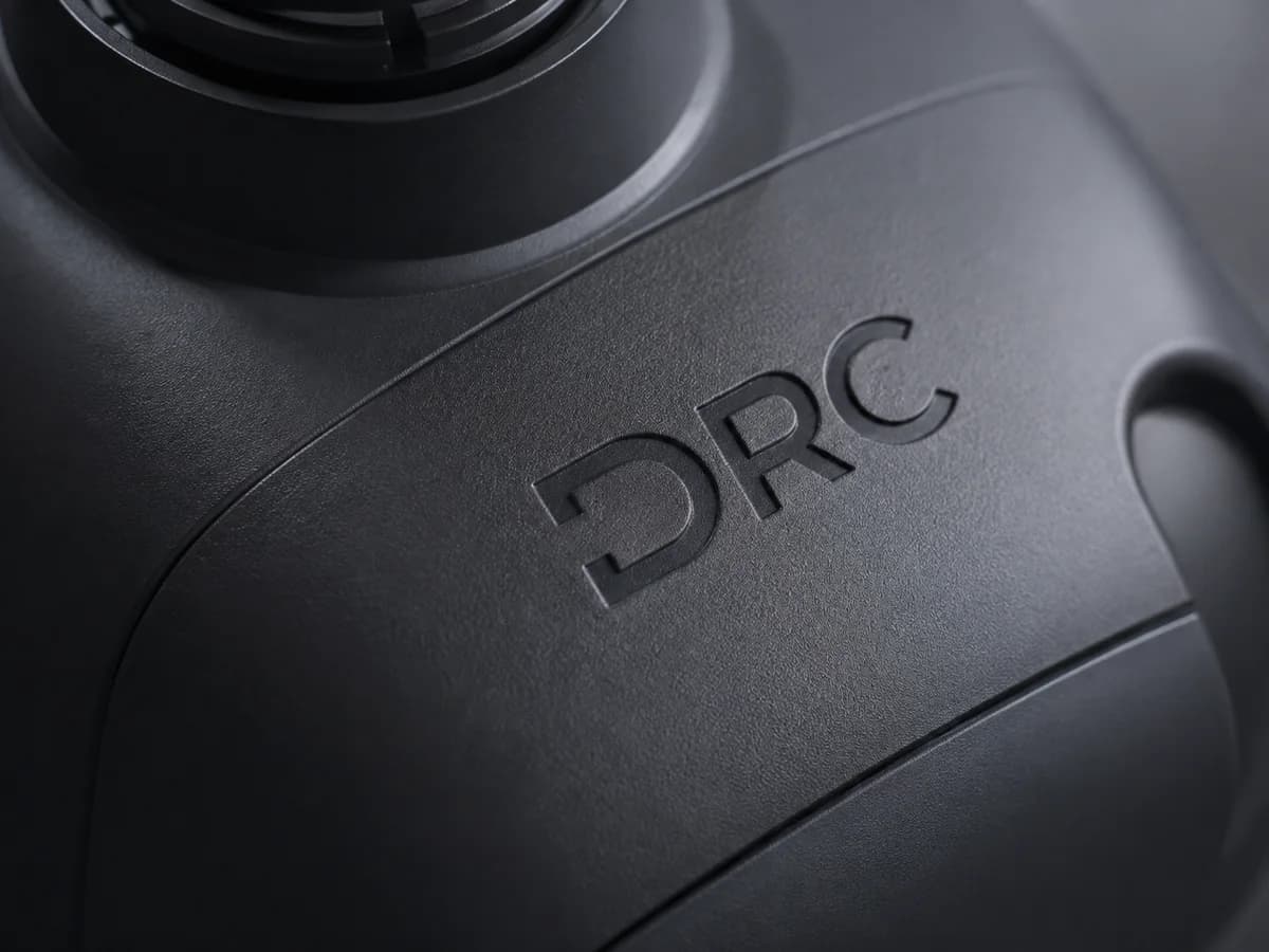 Laser-engraved DRC branding on a textured product housing