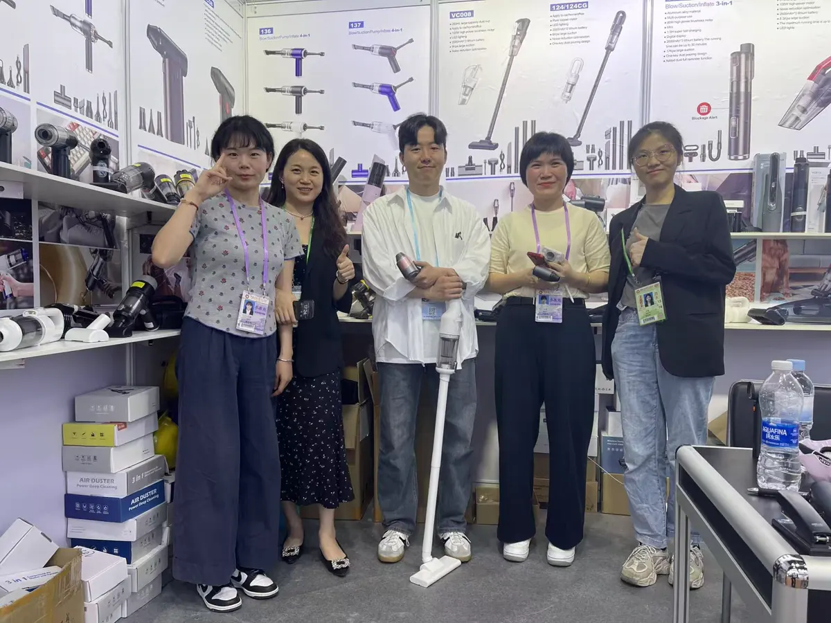 Buyer team visiting the DRC cordless vacuum display