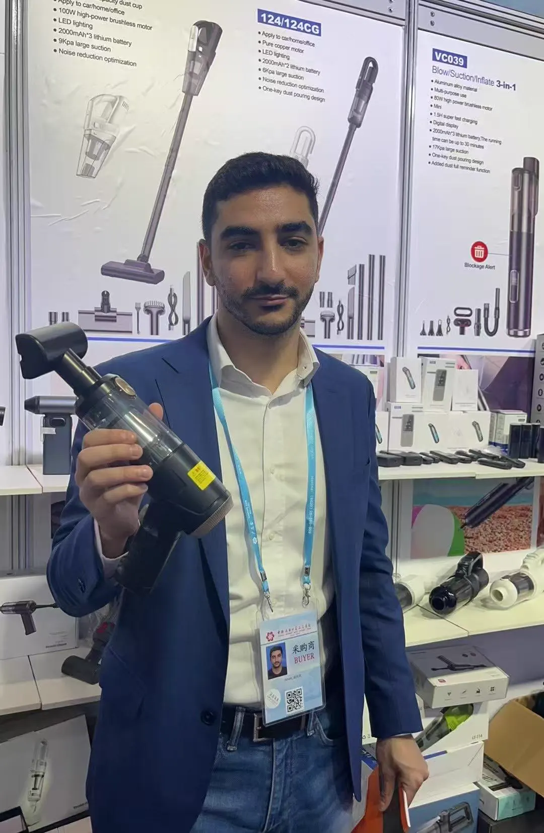 Business buyer holding a DRC portable vacuum cleaner