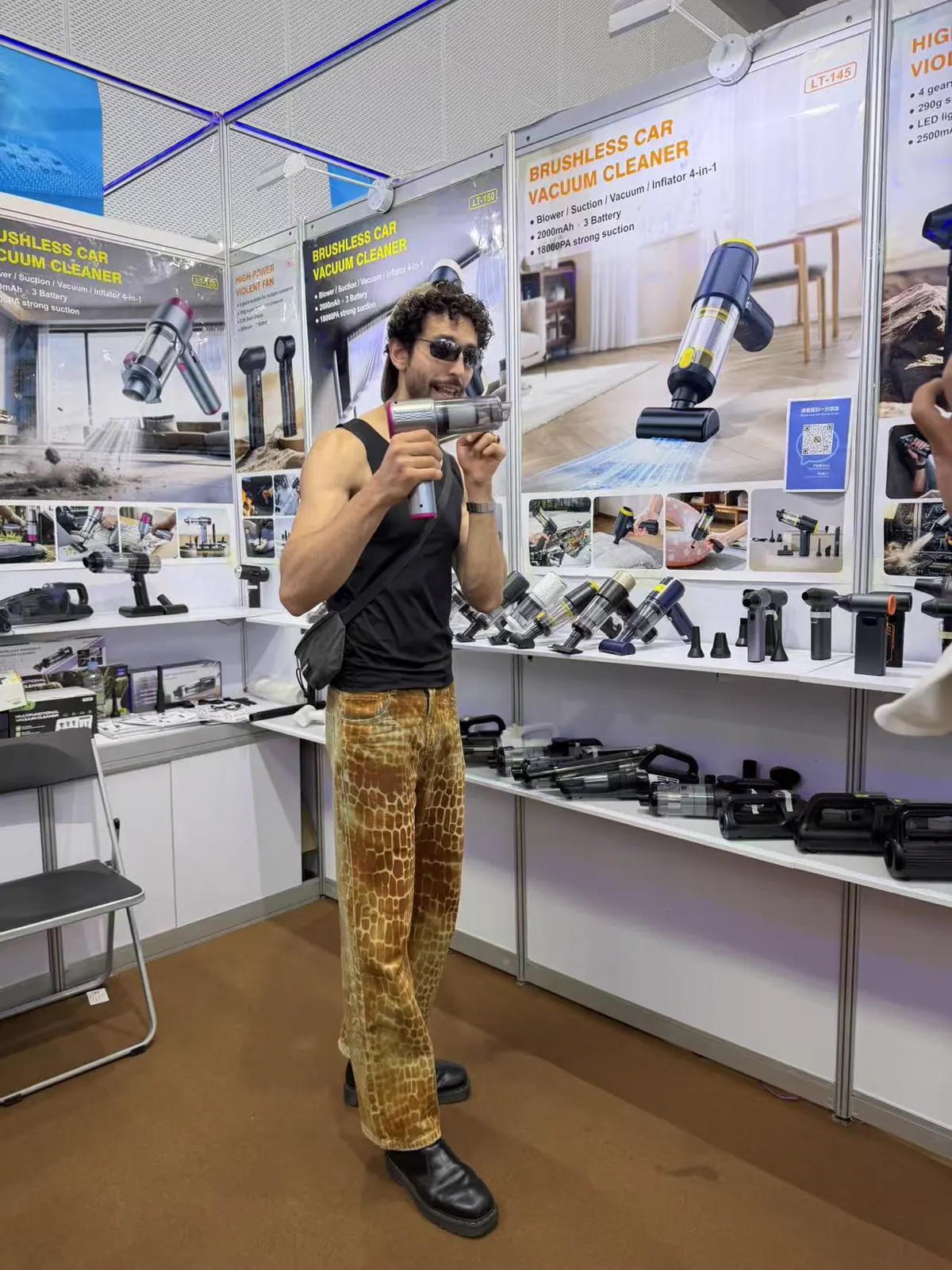 Buyer testing a DRC handheld vacuum cleaner