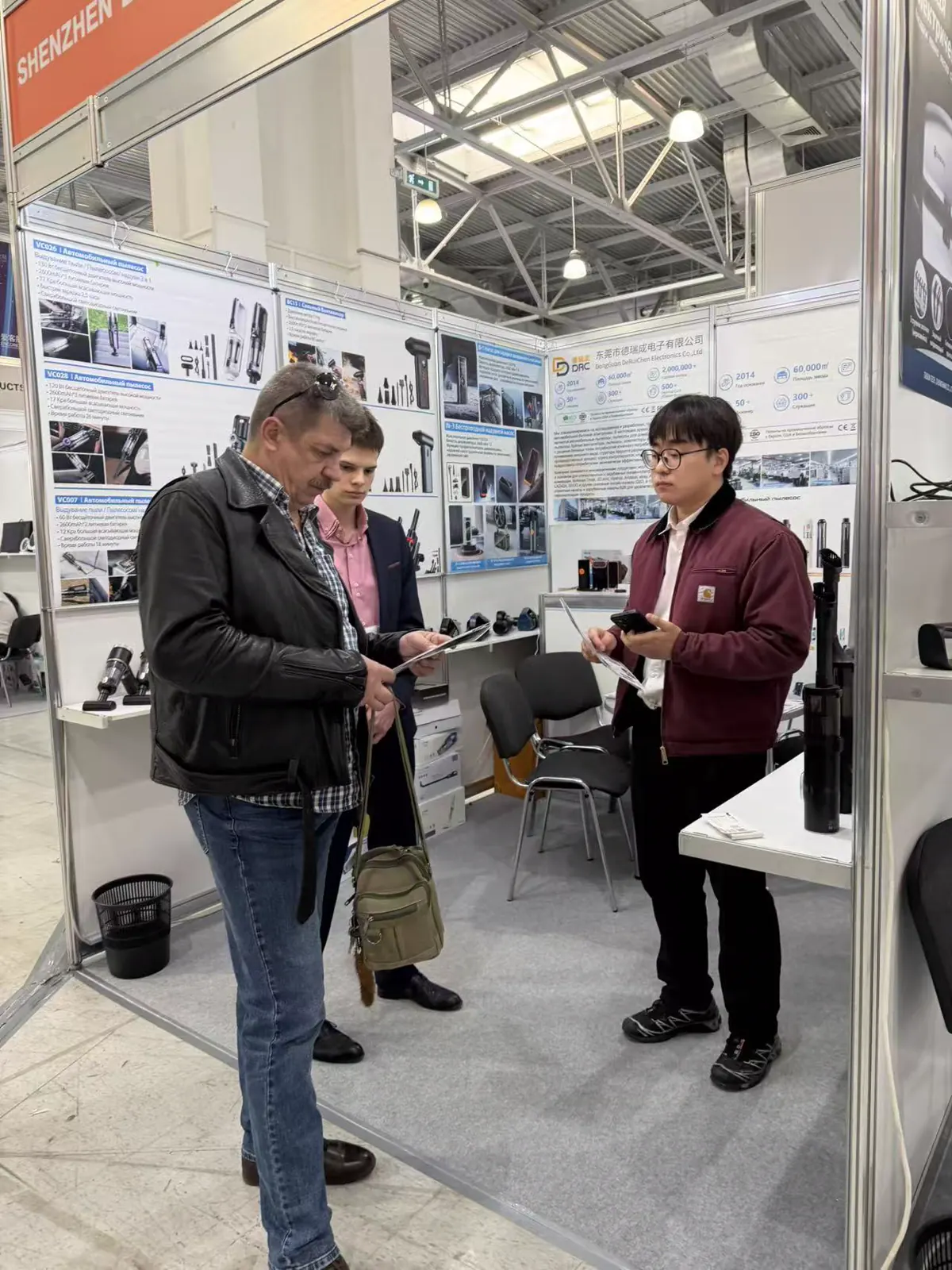 Overseas buyers reviewing product brochures with DRC staff